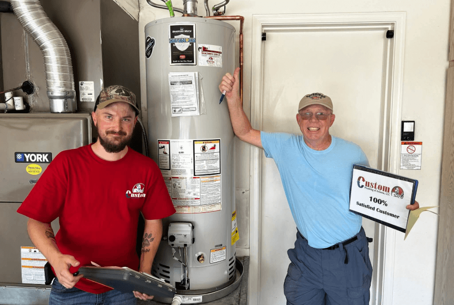 Team of Phoenix plumbers with drain cleaning equipment and satisfied customers